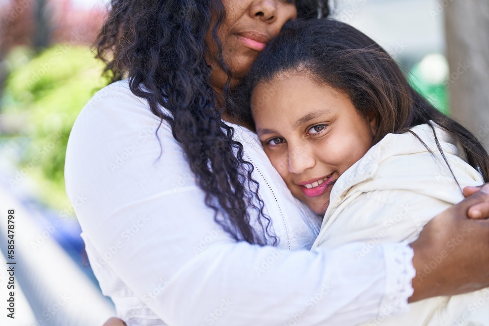 Mother and daughter smiling confident hugging each other at park Mother and daughter smiling confident hugging each other at park
