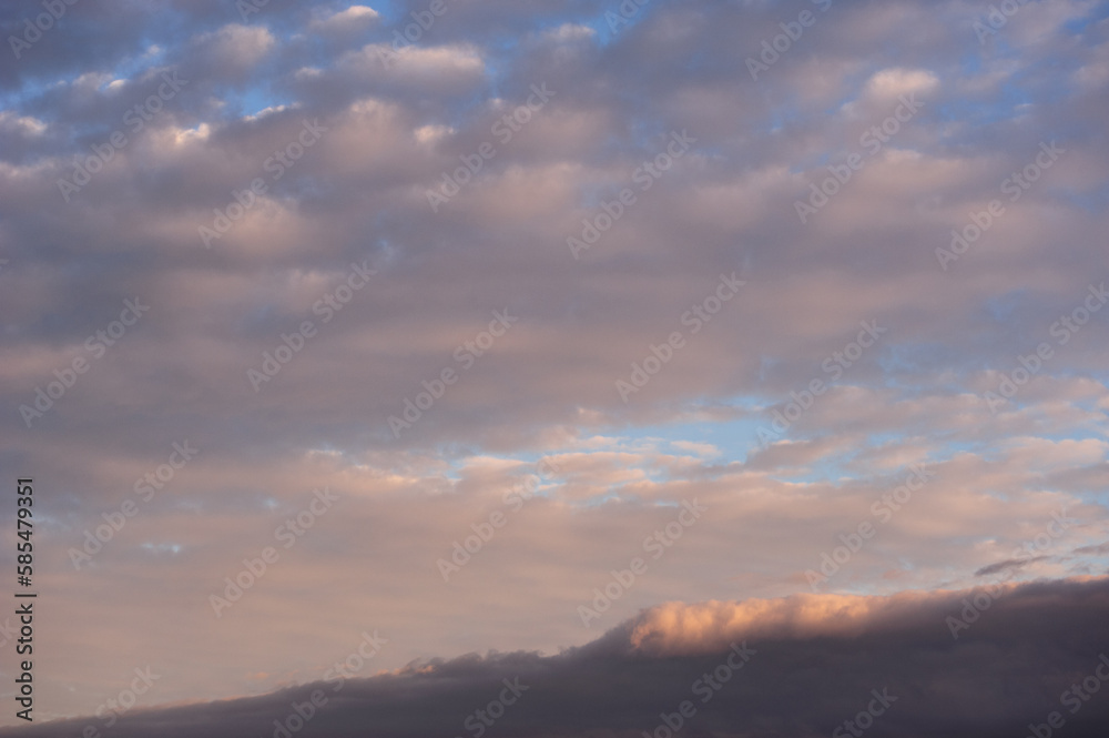 Natural background with clouds on sky at sunset 