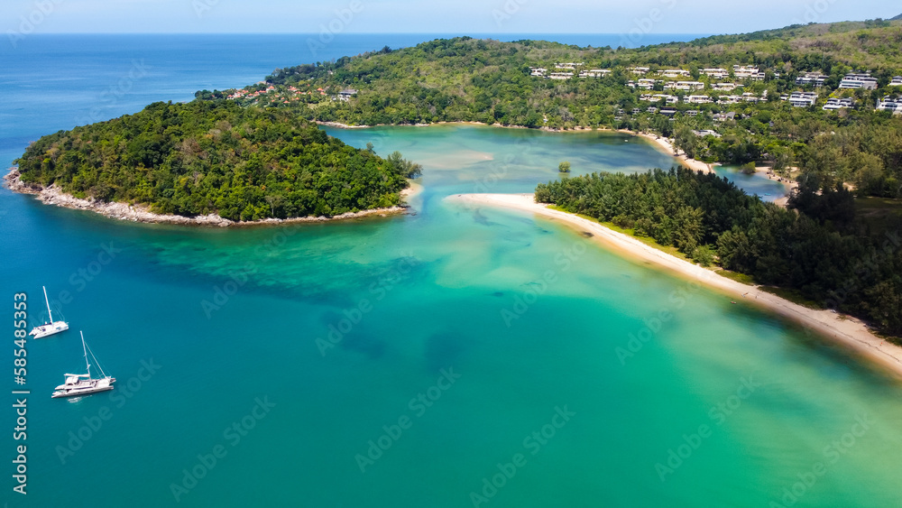 Aerial view of luxury yachts in turquoise waters of Andaman Sea near Bang Tao beach, Phuket, Thailand. Beautiful view from above.