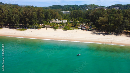 Aerial view of Bang Tao beach, Phuket, Thailand. Beautiful view of turquoise waters of Andaman Sea from above. © Alisa