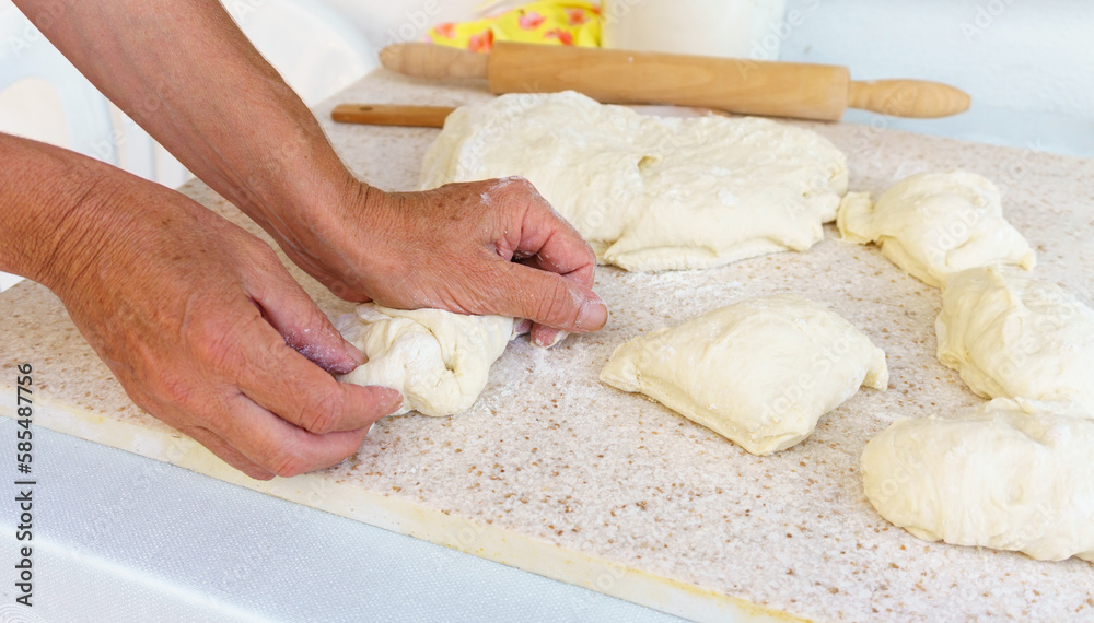 Chef kneading the dough on table Preparation of fresh and tasty homemade pastries. Unhealthy lifestyle, delicious fattening food concept photo. Chef kneading the dough on table Preparation of fresh and tasty homemade pastries. Unhealthy lifestyle, delicious fattening food concept photo.