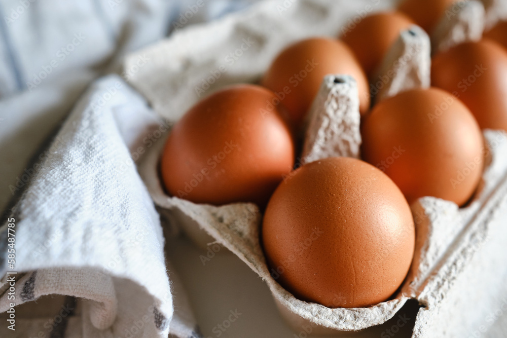 Cardboard boxes with chicken eggs. Boxes with uncooked eggs in table. Natural organic farm product. Preparing for Easter holiday. Fresh food delivery, carton package. Raw ingredient for cooking eat Cardboard boxes with chicken eggs. Boxes with uncooked eggs in table. Natural organic farm product. Preparing for Easter holiday. Fresh food delivery, carton package. Raw ingredient for cooking eat