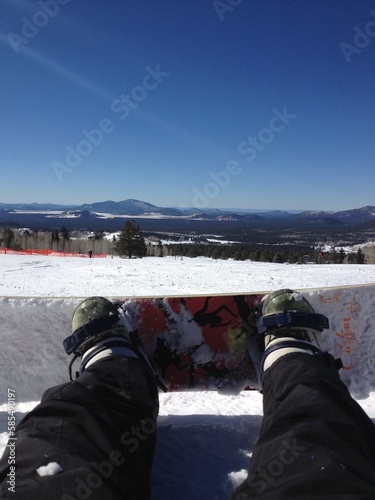 Snowboard on Feet at Ski Hill in Flagstaff, Arizona photo