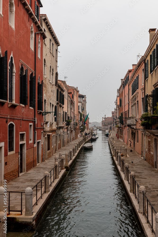 Venice, view of a canal on a misty day, old gothic buildings,	