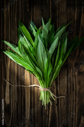 fresh ramson or wild garlic bunch on wooden table