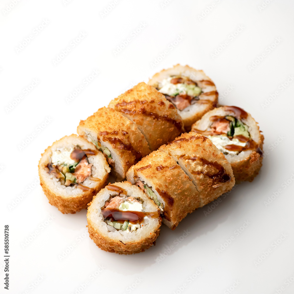 Hot fried Sushi Roll with cream cheese, cucumber, avocado, unagi sauce, baked salmon. Sushi menu. Japanese food. Seafood dishes. White background. Top view. Copy space. High quality photo