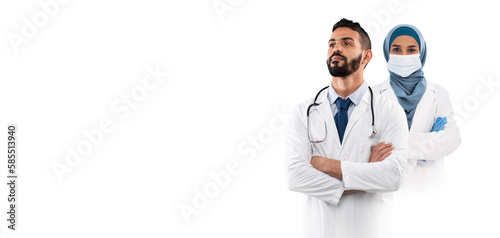 Arab Male And Female Doctor In Uniform Posing Isolated Over White Background