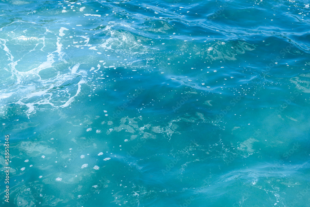 Natural background of blue foaming sea water Natural background of blue foaming sea water