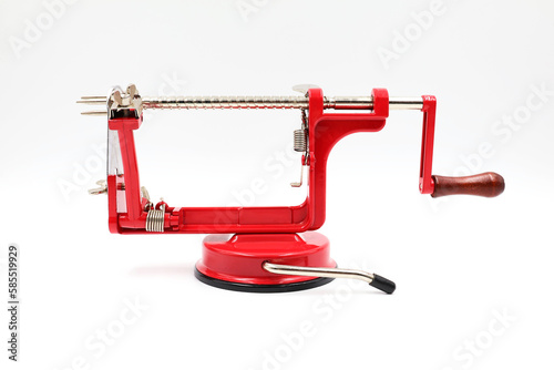 Red apple peeler. Manual apple peeling machine isolated on a white background.