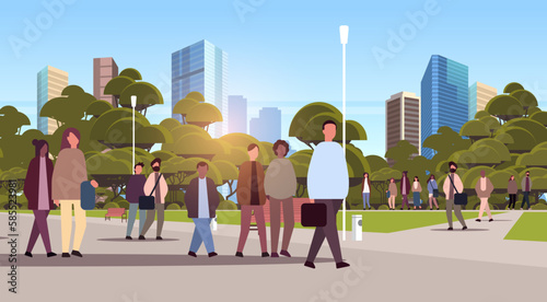 multiethnic people group walking outdoor mix race men women crowd spending time in urban park