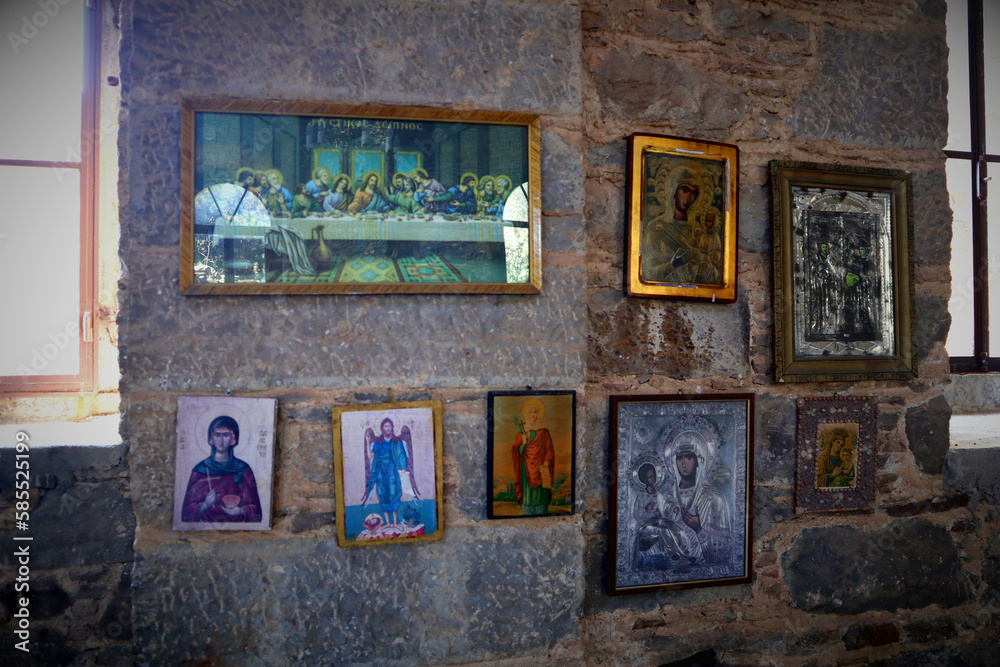 Vacation destination Chios Greece: religious images of saints insideSt. Nicholas church in small town Volissos on unplastered wall
