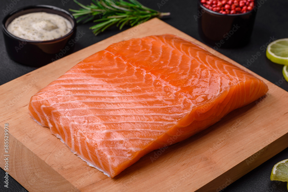 Fresh tasty raw red fish fillet with spices and herbs Fresh tasty raw red fish fillet with spices and herbs