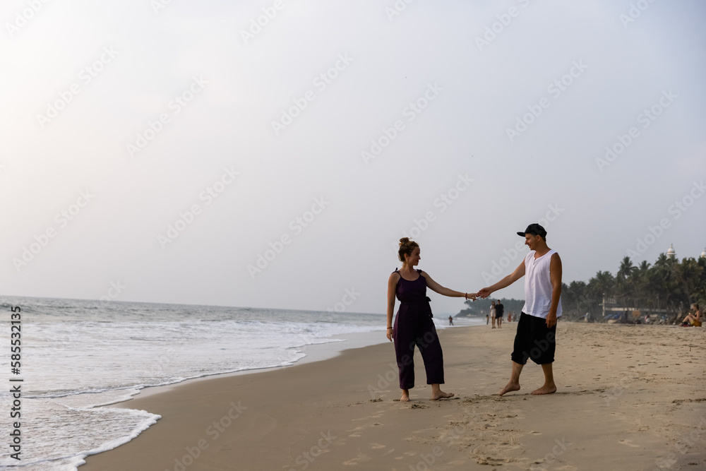 A couple in love embrace on the beach during vacation. There is love between the people.