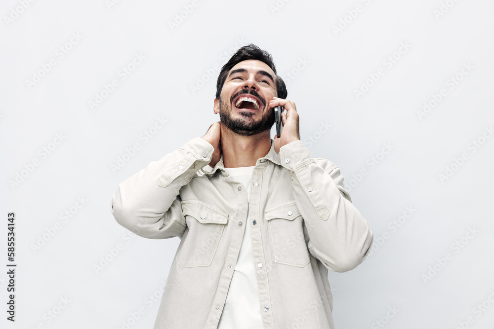 Closeup portrait man talking on the phone smiling and laughing happiness communication on white isolated background, fashionable clothing style, copy space, space for text Closeup portrait man talking on the phone smiling and laughing happiness communication on white isolated background, fashionable clothing style, copy space, space for text