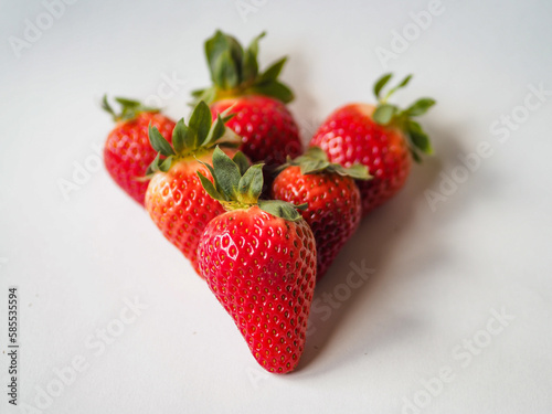 Strawberry on white background. Fresh sweet fruit closeup photo