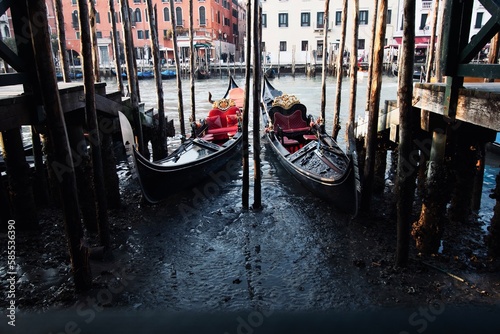 Gondolas in Venice Grand Canal with exceptionally low tide