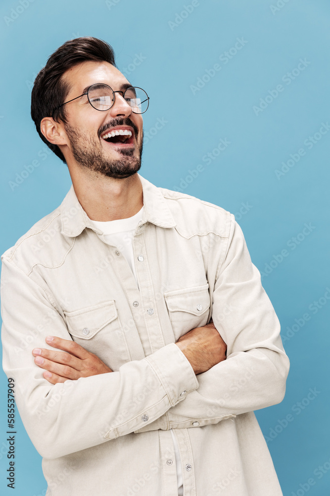 Portrait of a stylish man smile with teeth in glasses for farsightedness and myopia, on a blue background in a white T-shirt, fashionable clothing style, space space Portrait of a stylish man smile with teeth in glasses for farsightedness and myopia, on a blue background in a white T-shirt, fashionable clothing style, space space