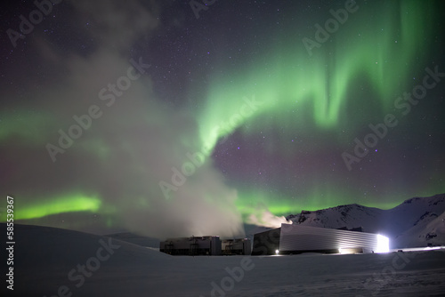 Aurora borealis above geothermal power station, Iceland © Arctic Mystic