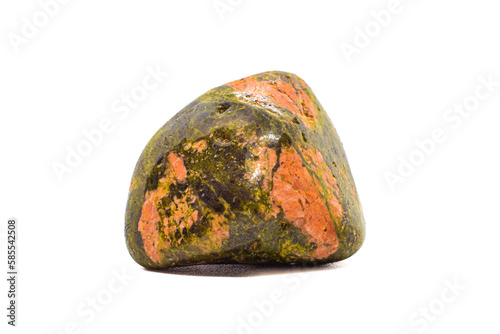 Macro tumbled green and orange unakite jasper crystal, silicate chalcedony mineral variety, isolated on a white surface background   photo