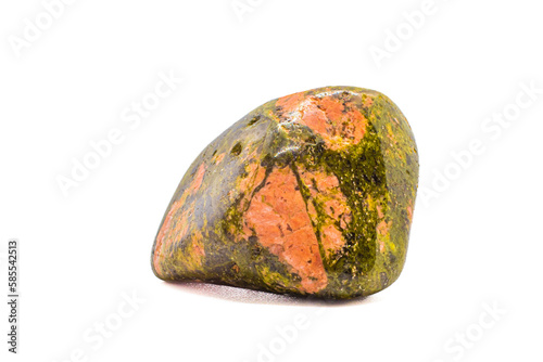 Macro tumbled green and orange unakite jasper crystal, silicate chalcedony mineral variety, isolated on a white surface background   photo
