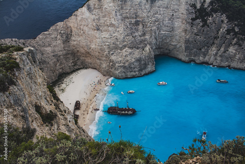 Fototapeta Naklejka Na Ścianę i Meble -  Zakynthos, Greece: A Pirate Boat Adventure Amidst Stunning Sea and Mountain Backdrops
