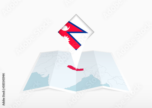Nepal is depicted on a folded paper map and pinned location marker with flag of Nepal. © boldg