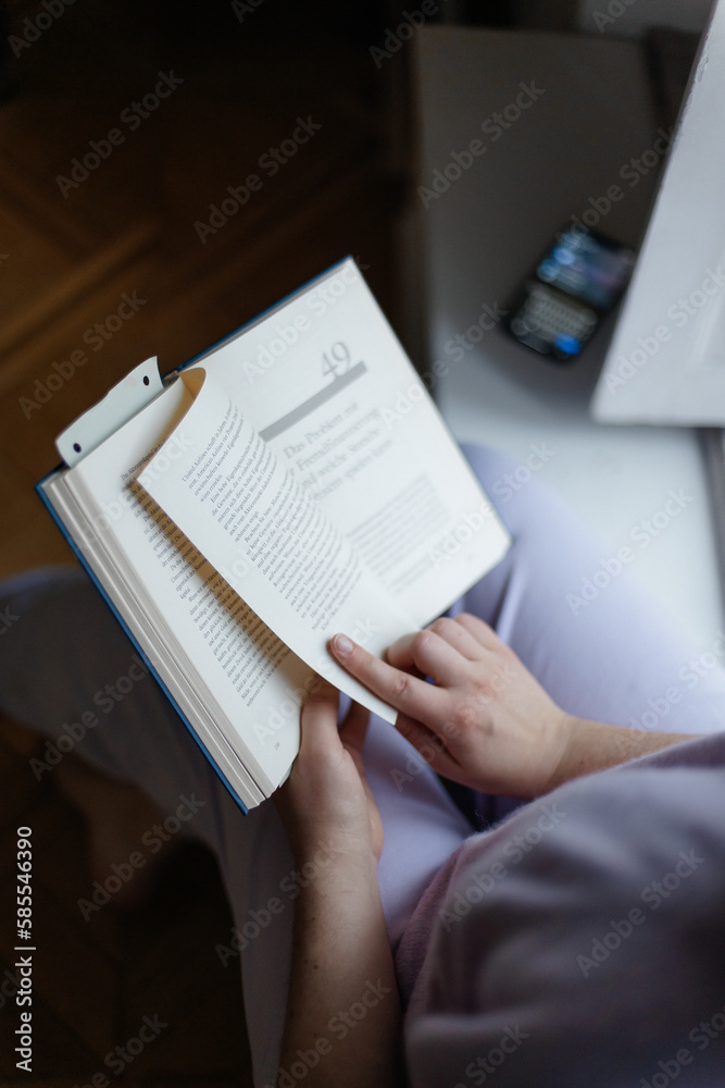 Fototapeta premium person reading a book