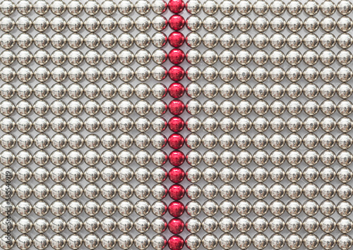 Full frame of chrome metal magnet balls divided by the red line