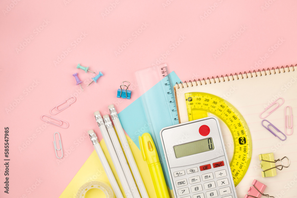 Fototapeta premium Stationery items for girls or women on light pink background. Back to school. Female Student's, pupil's or engineer's supplies. Office objects on pastel pink background