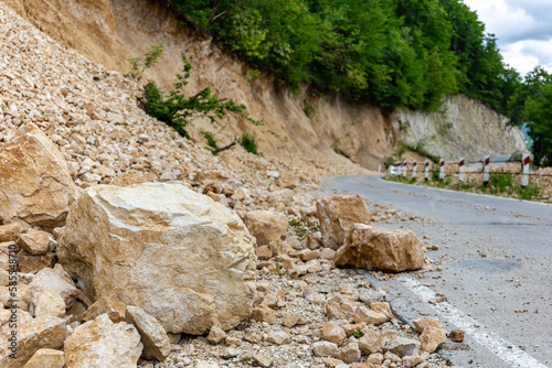 Limestone rockfall and landslide fallen and blocking tarmac road leading to Khvamli Mountain peak in Georgia. photo