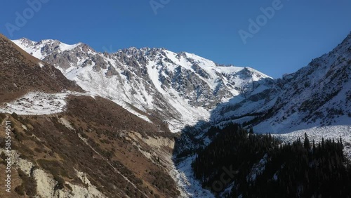 Wallpaper Mural Drone view of scenery mountain peaks covered by snow. Beautiful mountains of Kyrgyzstan Republic Torontodigital.ca