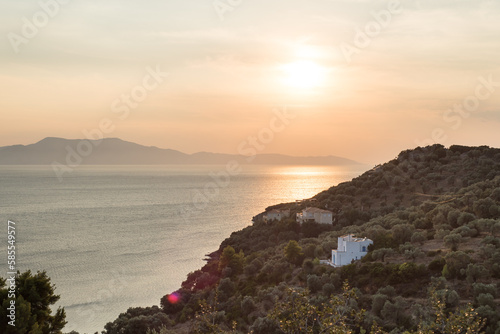 Sonnenuntergang über idyllischem Mittelmeer Küstenabschnitt der griechischen Insel Alonnisos photo