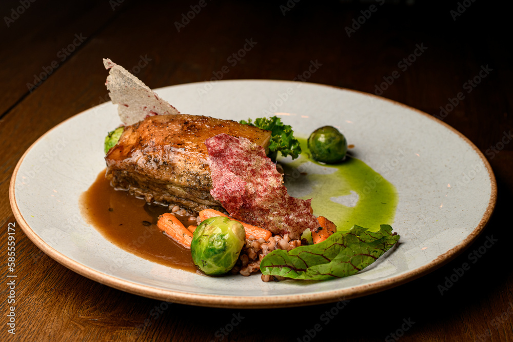 great view on dish of piece of baked meat with buckwheat and vegetables on plate