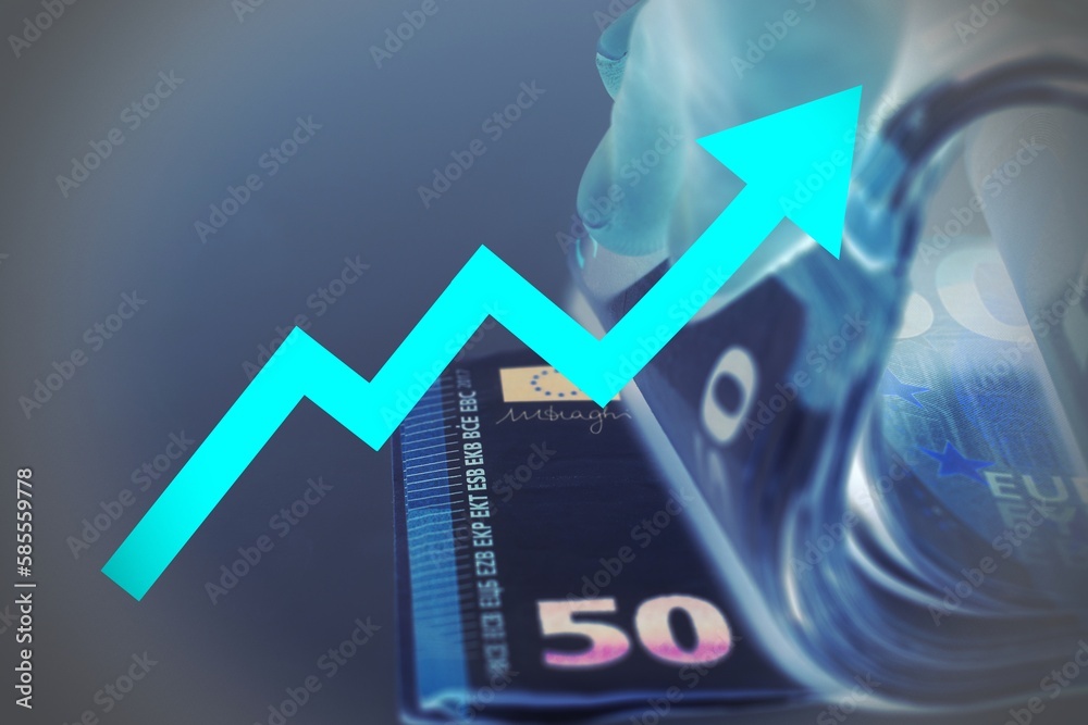 Close up of a hand counting money with a red arrow sign. Close up of a hand counting money with a red arrow sign.