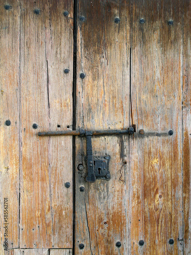 antique wooden door with iron bolt in Gran Canaria © C P