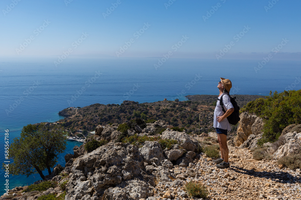 Seascape with an adult man, the concept of active recreation and longevity, Greece, Crete