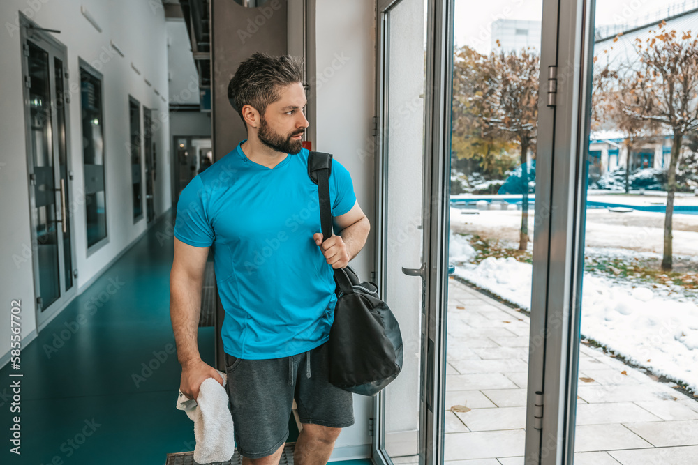 Athlete leaving gym after a good workout Athlete leaving gym after a good workout
