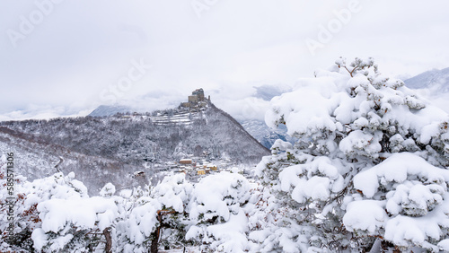 Image of the Ancient/ Abbey of San Michele built on Mount Pirchiriano located at the entrance of the Susa Valley, around the years between 983 and 987 A.D. with an abundant snowfall photo