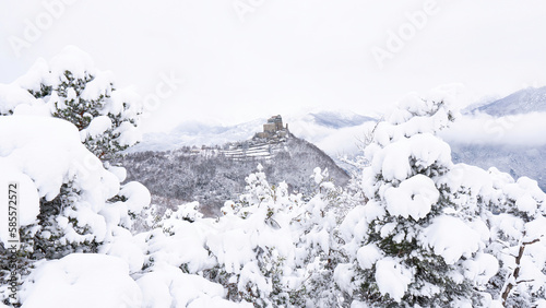 Image of the Ancient/ Abbey of San Michele built on Mount Pirchiriano located at the entrance of the Susa Valley, around the years between 983 and 987 A.D. with an abundant snowfall