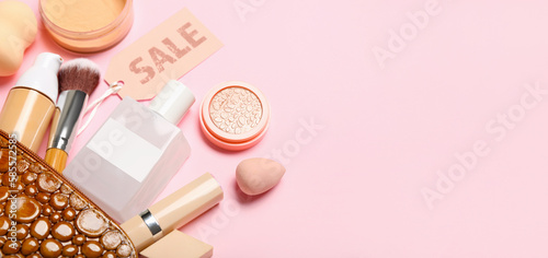 Bag with makeup cosmetics and accessories for sale on pink background with space for text