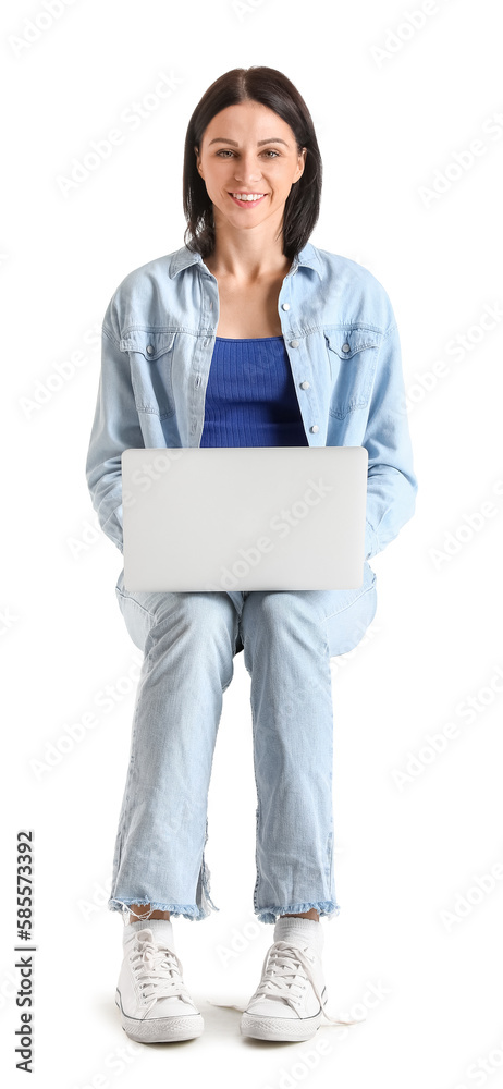 Pretty young woman with laptop sitting on chair against white background Pretty young woman with laptop sitting on chair against white background