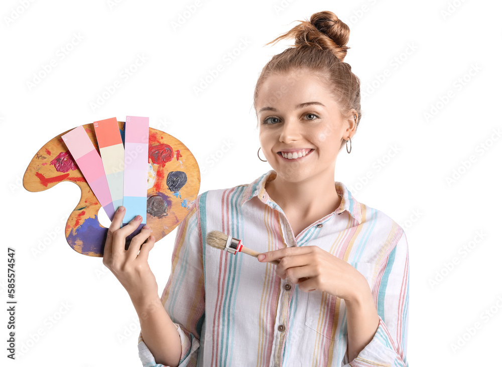 Female artist with brush pointing at color samples and paint palette on white background Female artist with brush pointing at color samples and paint palette on white background