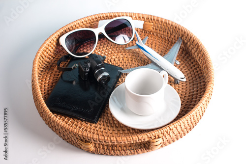 Tourism, collecting things and suitcases. Waiting for the plane with a cup of coffee and a passport. The concept of travel