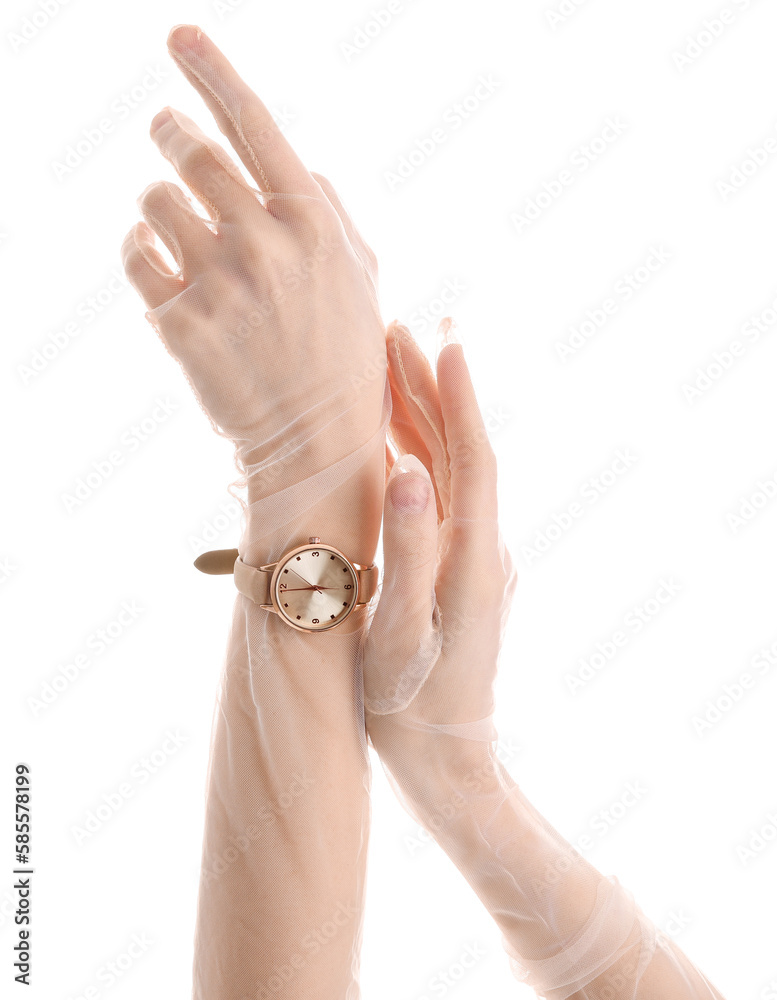 Woman in gloves with golden wristwatch on white background