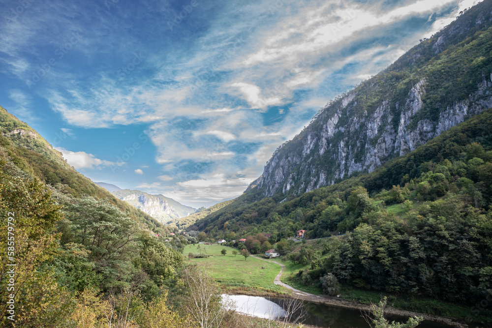Panorama of the River Cerna Valley, called Valea Cerna, with a panorama of the Mehedinti Mountains, near Baile Herculane, in Romania, in the Carpathian mountains.