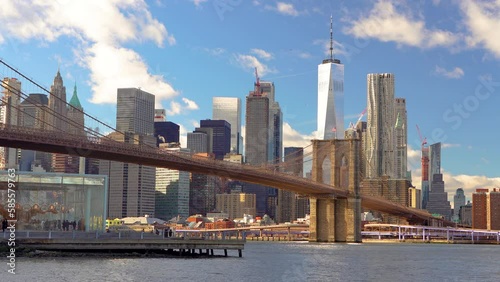 Panoramic view of Brooklyn bridge and Manhattan at sunny day, New York City.