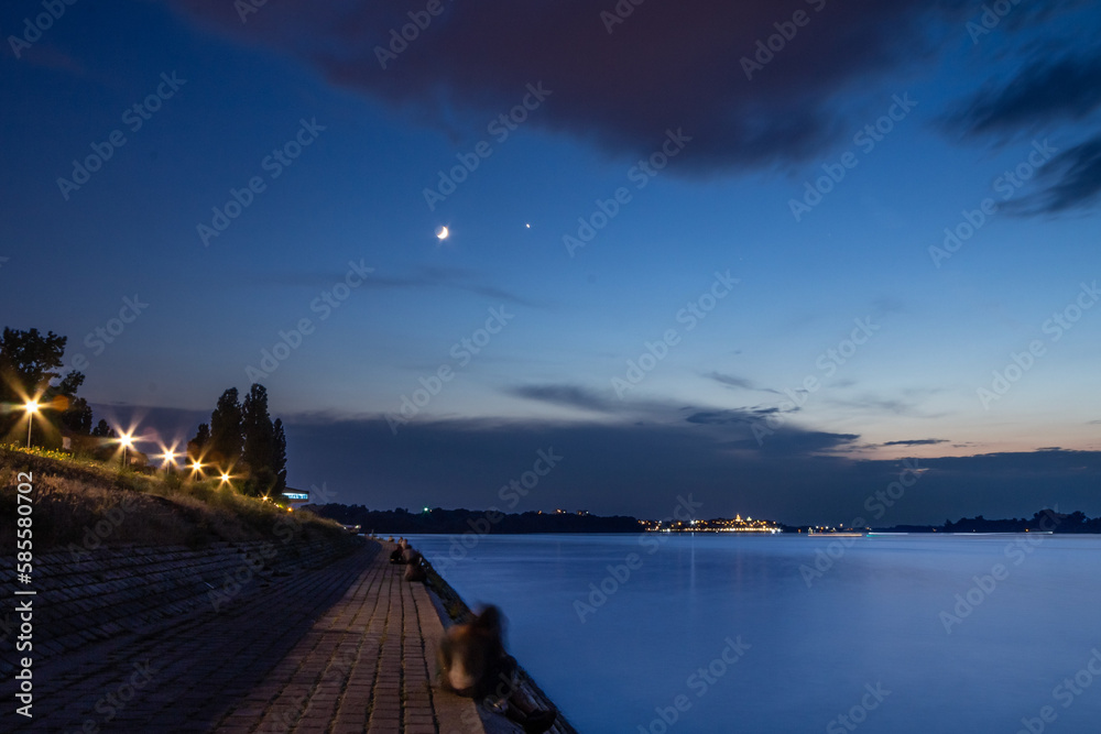 Selective blur on a Panorama of the Danube river, also called Dunav, from the quay of the city center of Belgrade, capital city of Serbia at night. Danube is the second longest river in continental Eu
