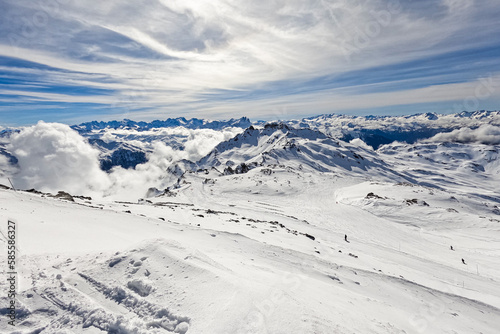 View of the French Alps in winter from the summit of "Cime de Caron" - Snowy peaks in altitude, covered by ski slopes © Alexandre ROSA