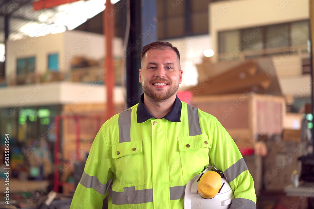 Fototapeta premium Happy caucasian white male factory worker or engineer portrait, a senior professional engineer or foreman portrait in factory.