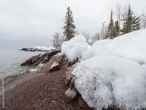 Snow covered beach of Lake Superior shoreline in the Tettegouche State Park, MN photo